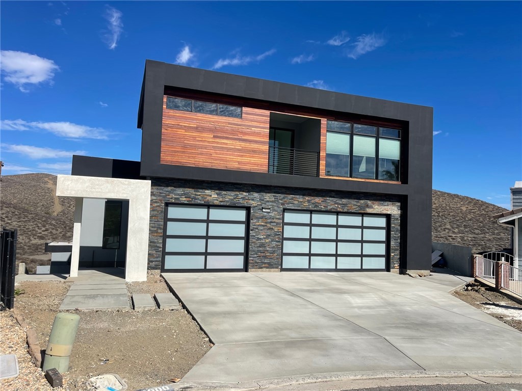 a front view of a house with a garage