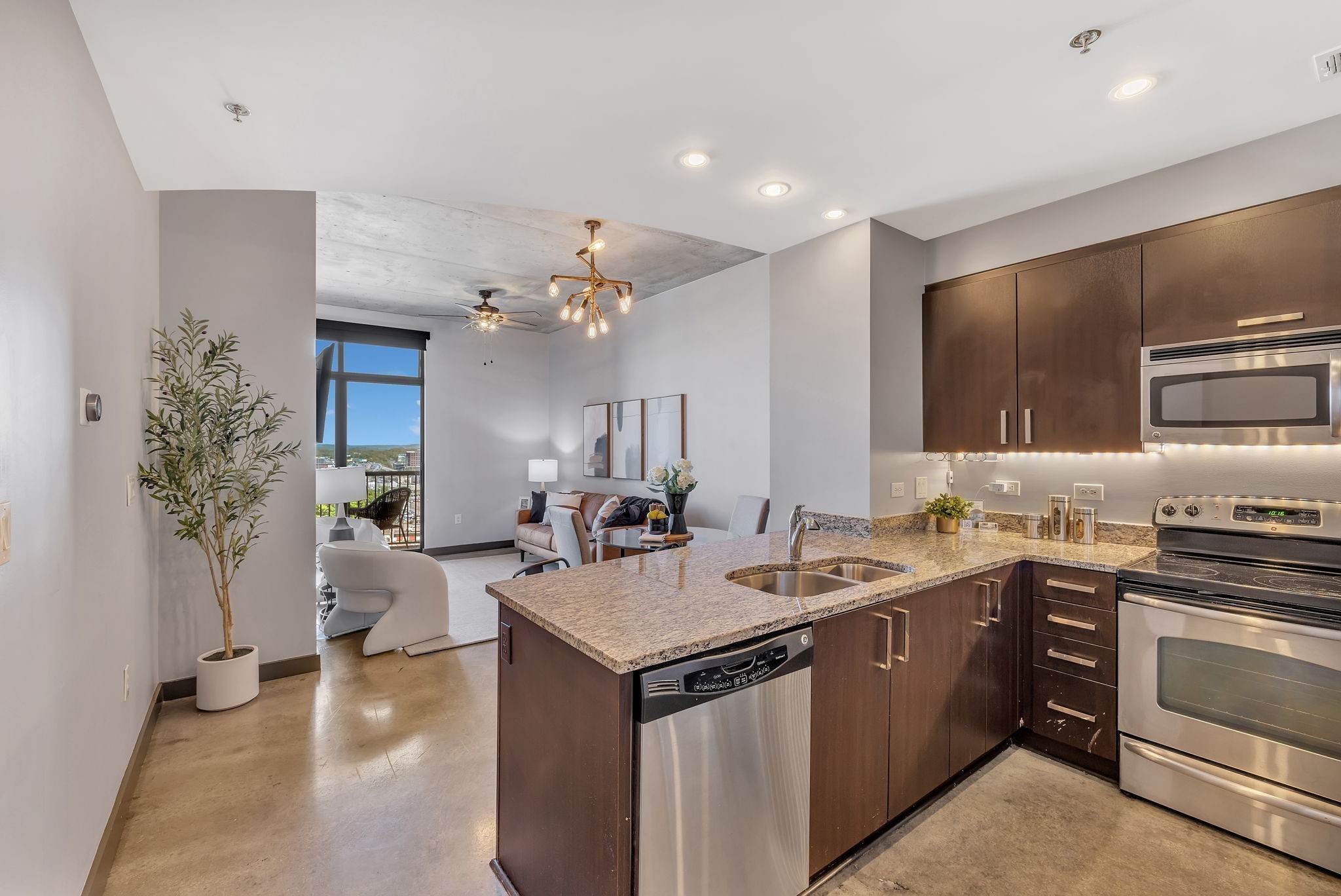 a kitchen with a sink stove and cabinets