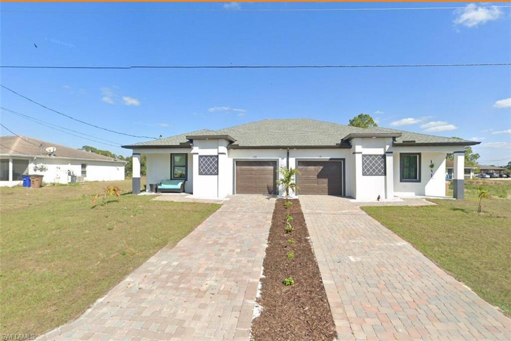 front view of a house with a yard