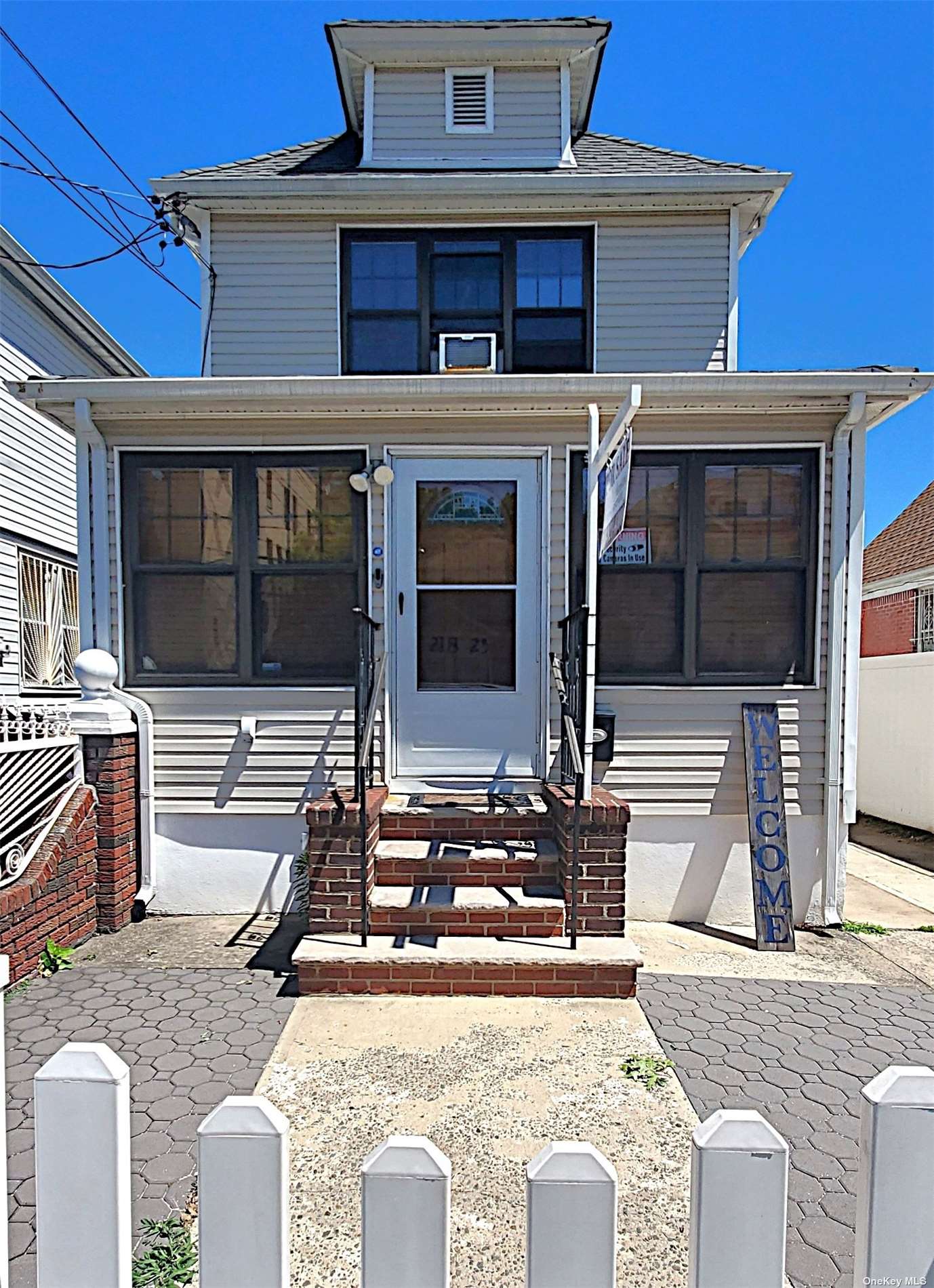 front view of a house with a balcony