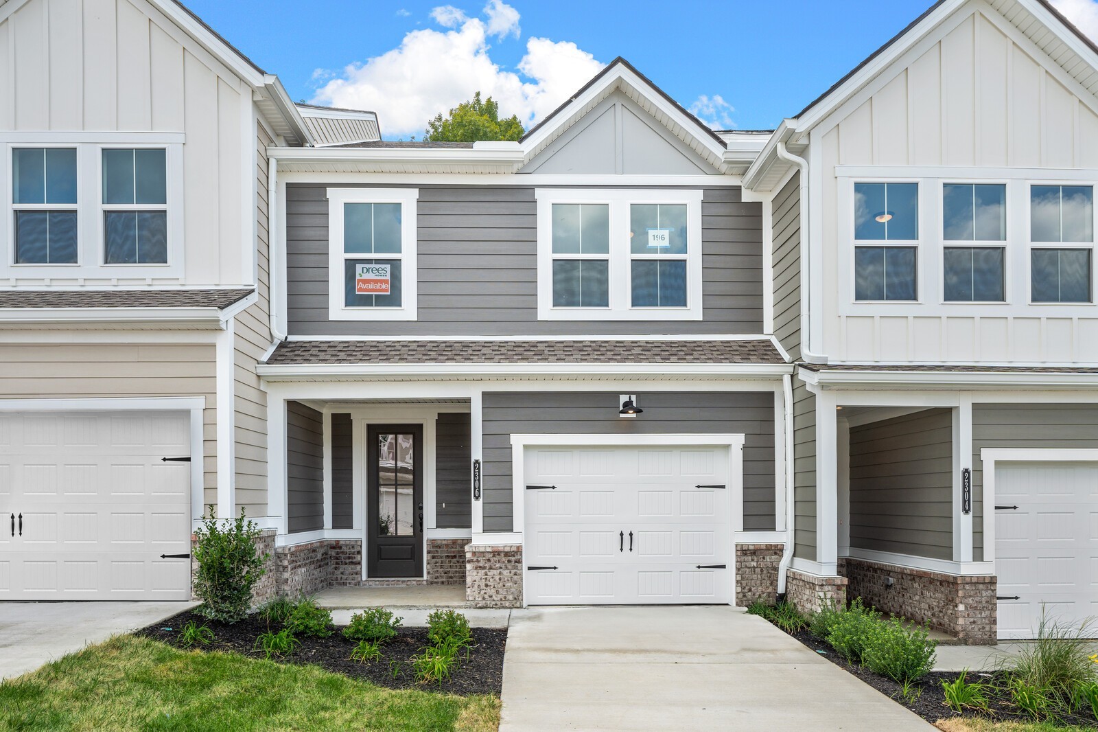 front view of a house with a yard