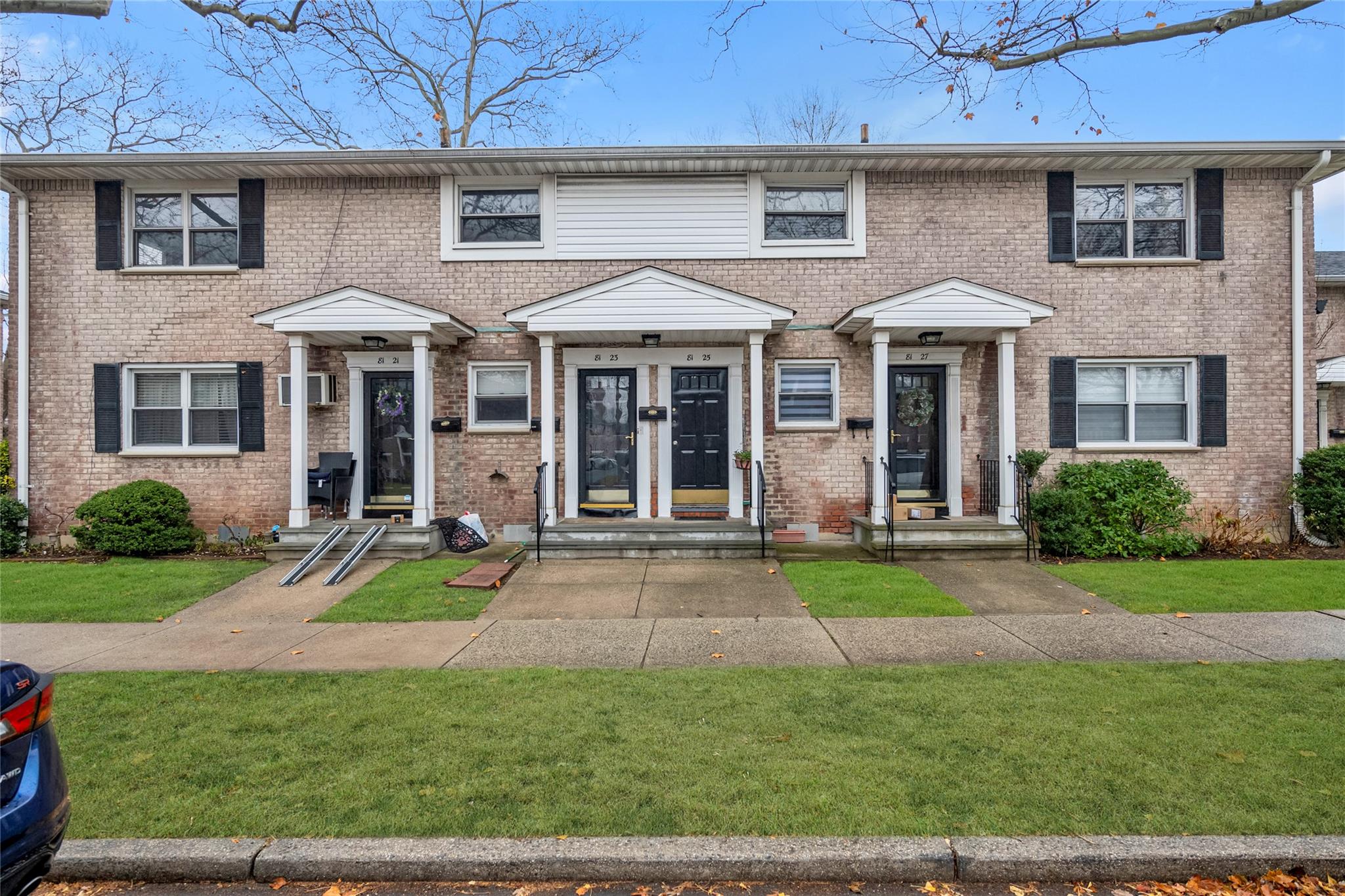 front view of a house with a yard