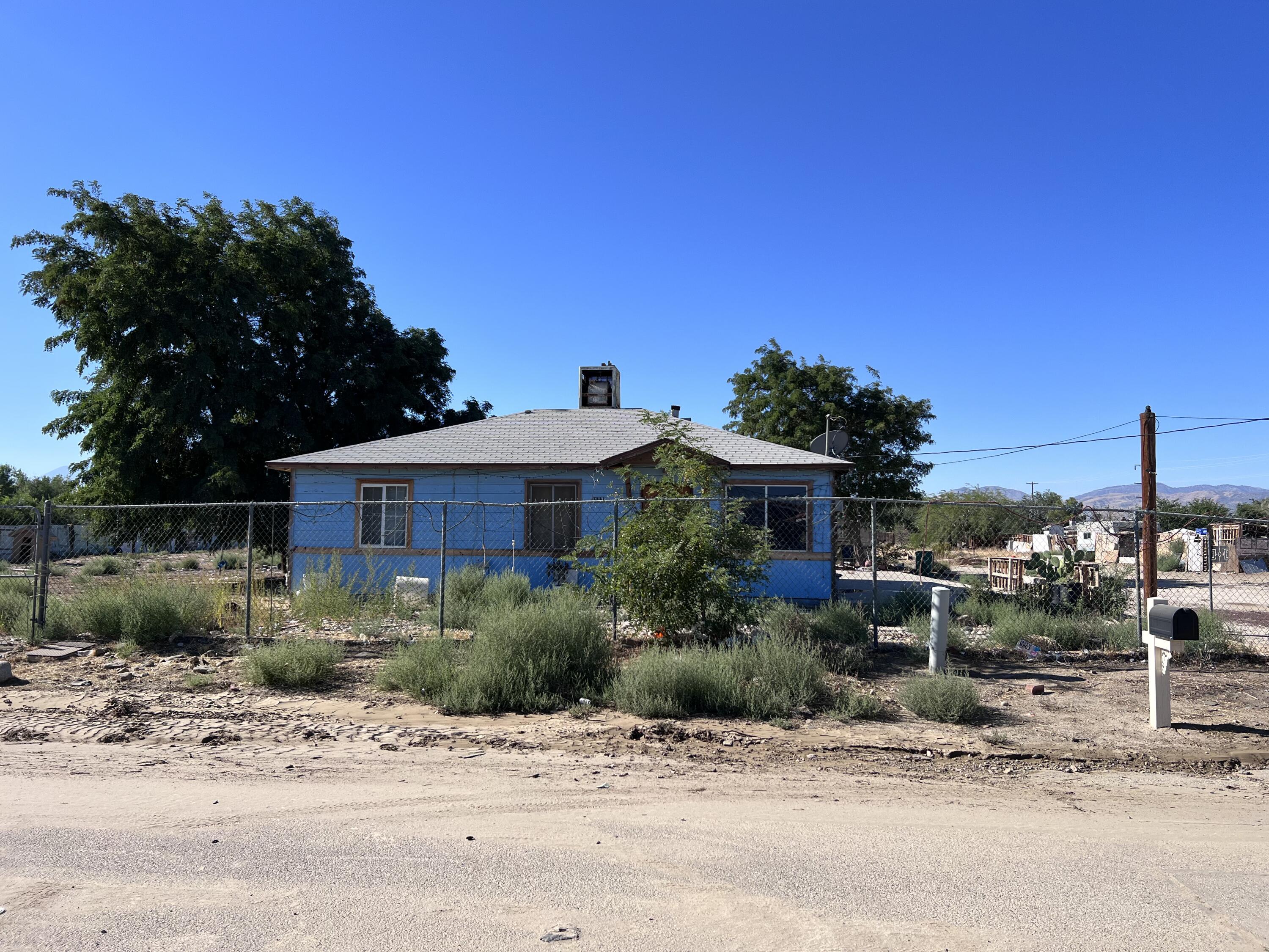 a view of a house with a street