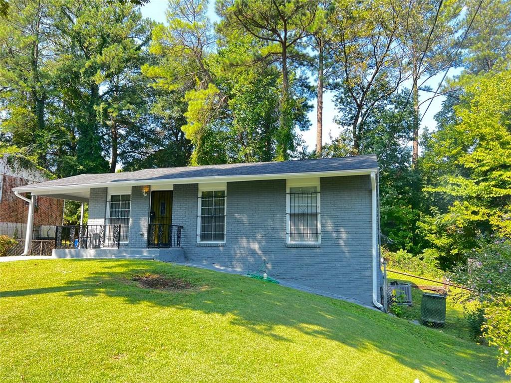 a view of a house with swimming pool and a porch with furniture