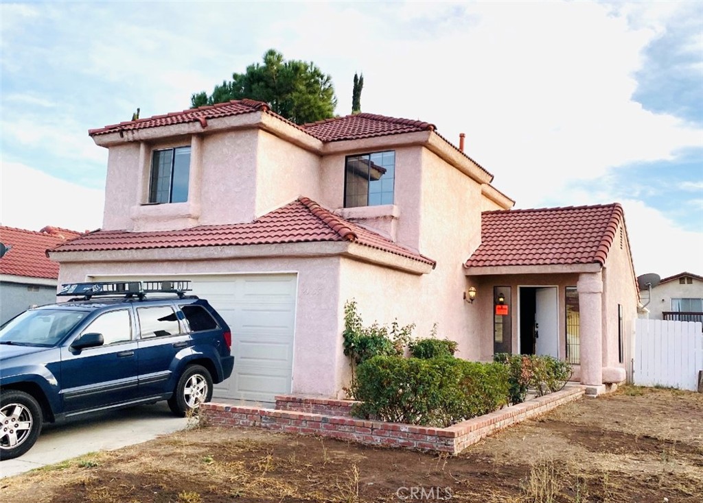 a car parked in front of a house