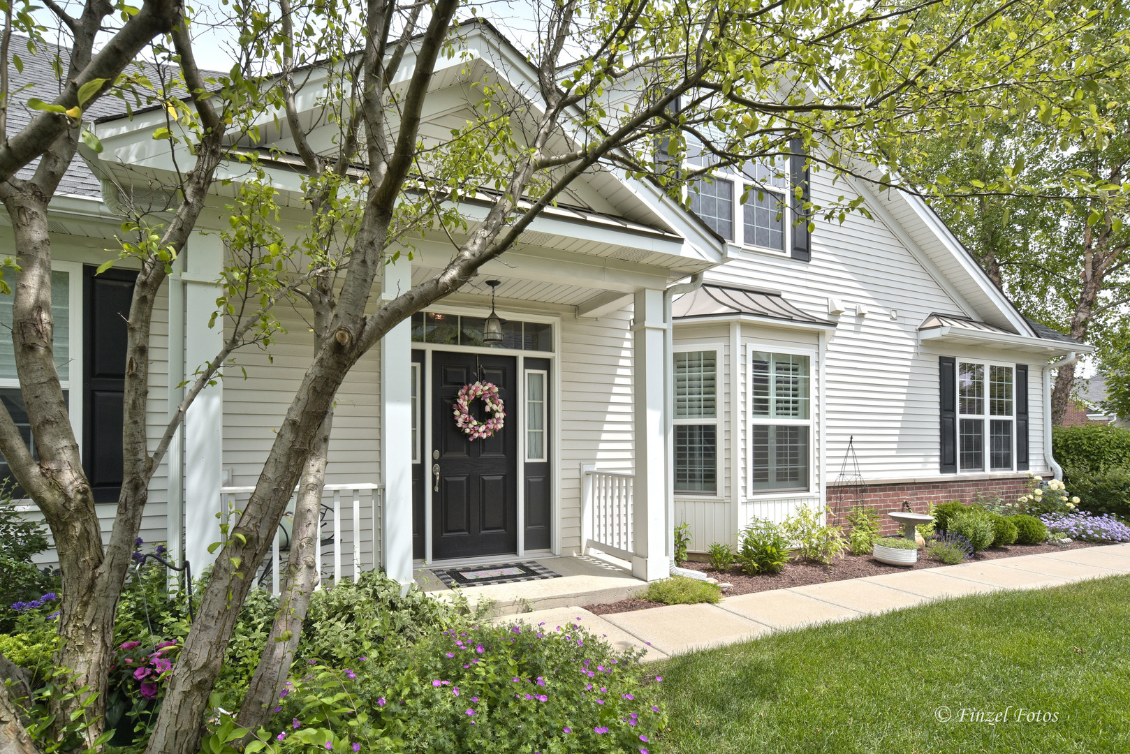 front view of a house with a yard