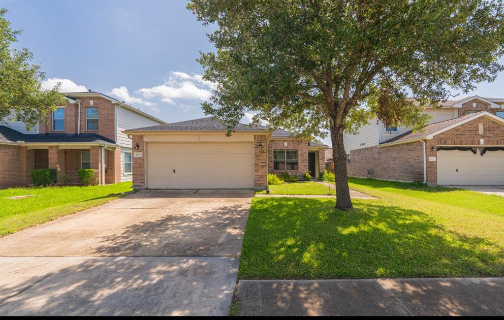 a backyard of a house with yard and garage