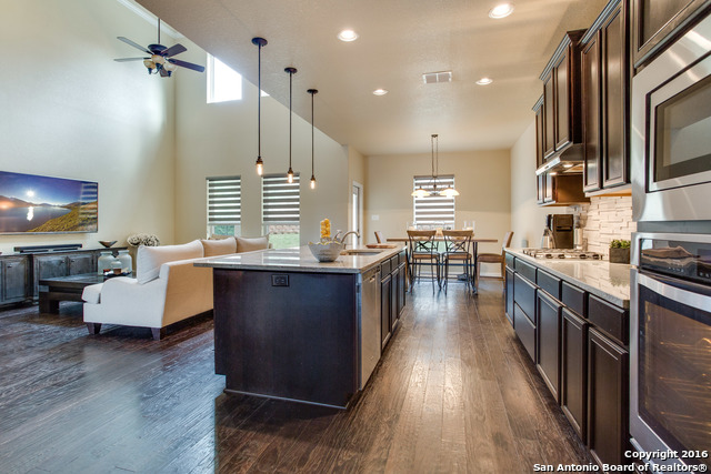 a kitchen with granite countertop lots of counter top space