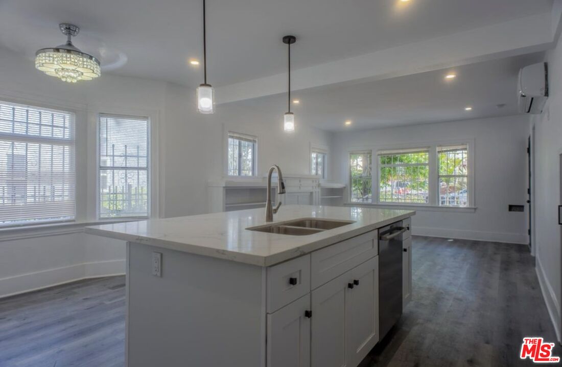 a kitchen with counter top space and a sink