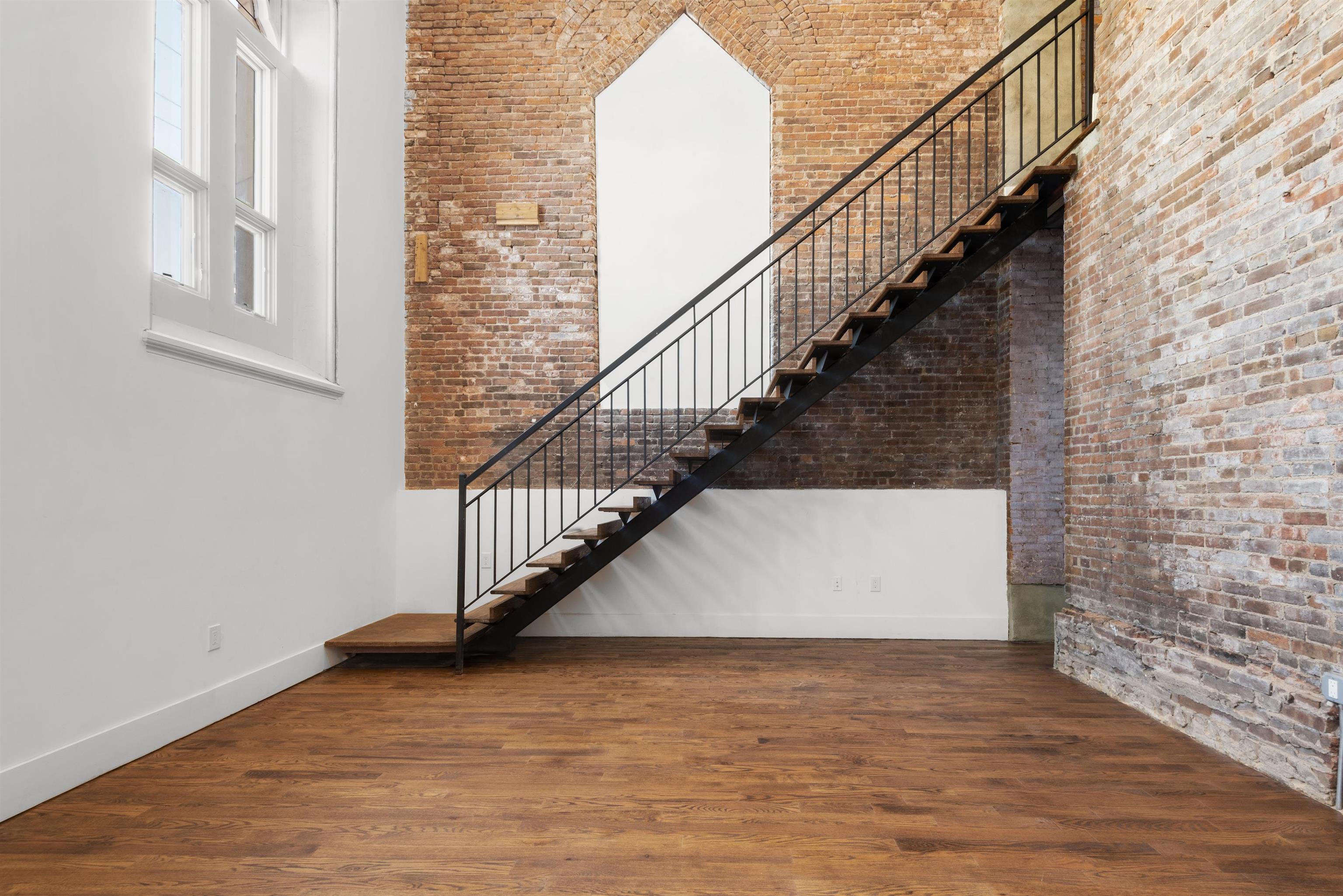 a view of entryway with wooden floor