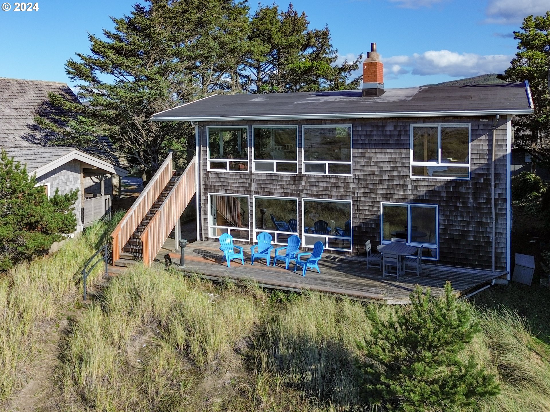 a view of house with swimming pool and porch