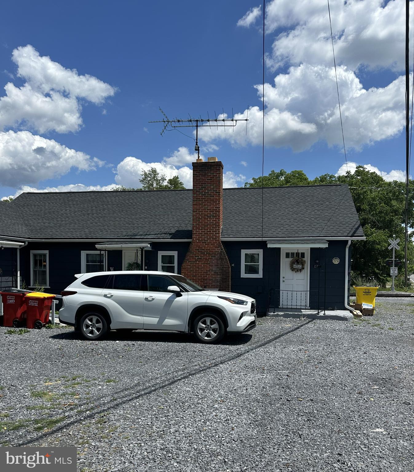 a front view of a house with parking space