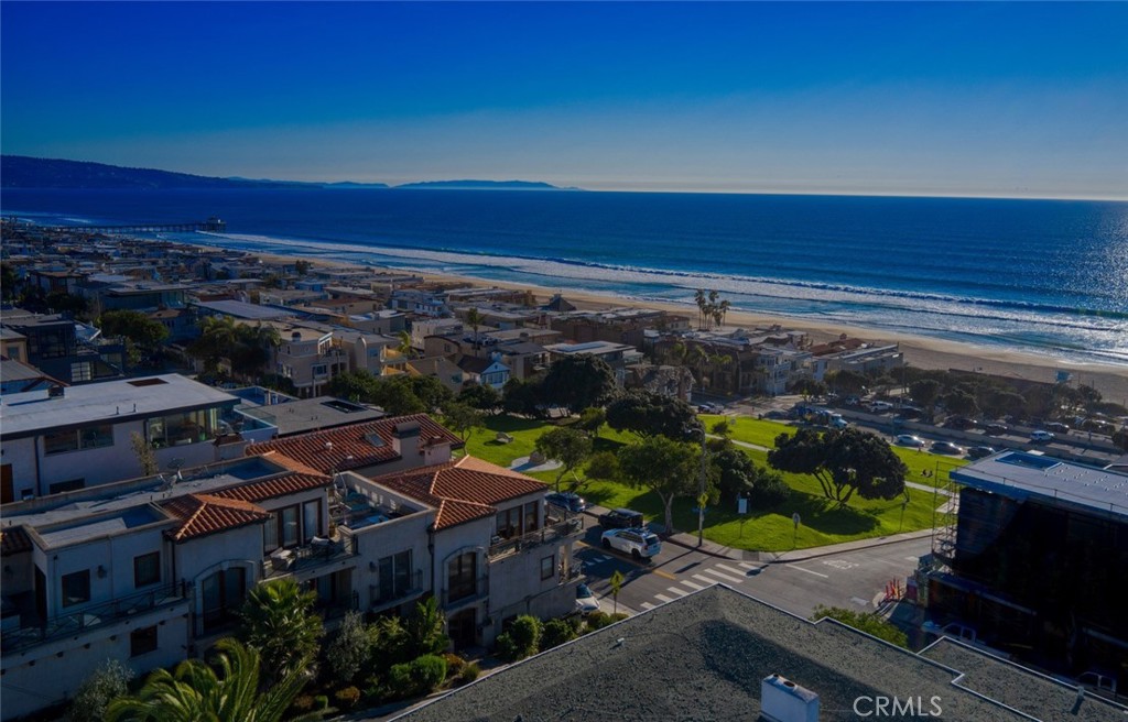 a view of city with ocean