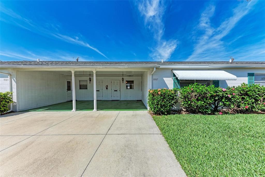 front view of a house with a yard