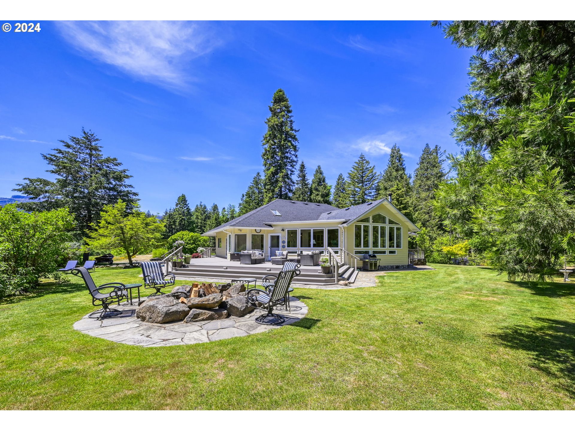 a view of a house with a yard porch and sitting area