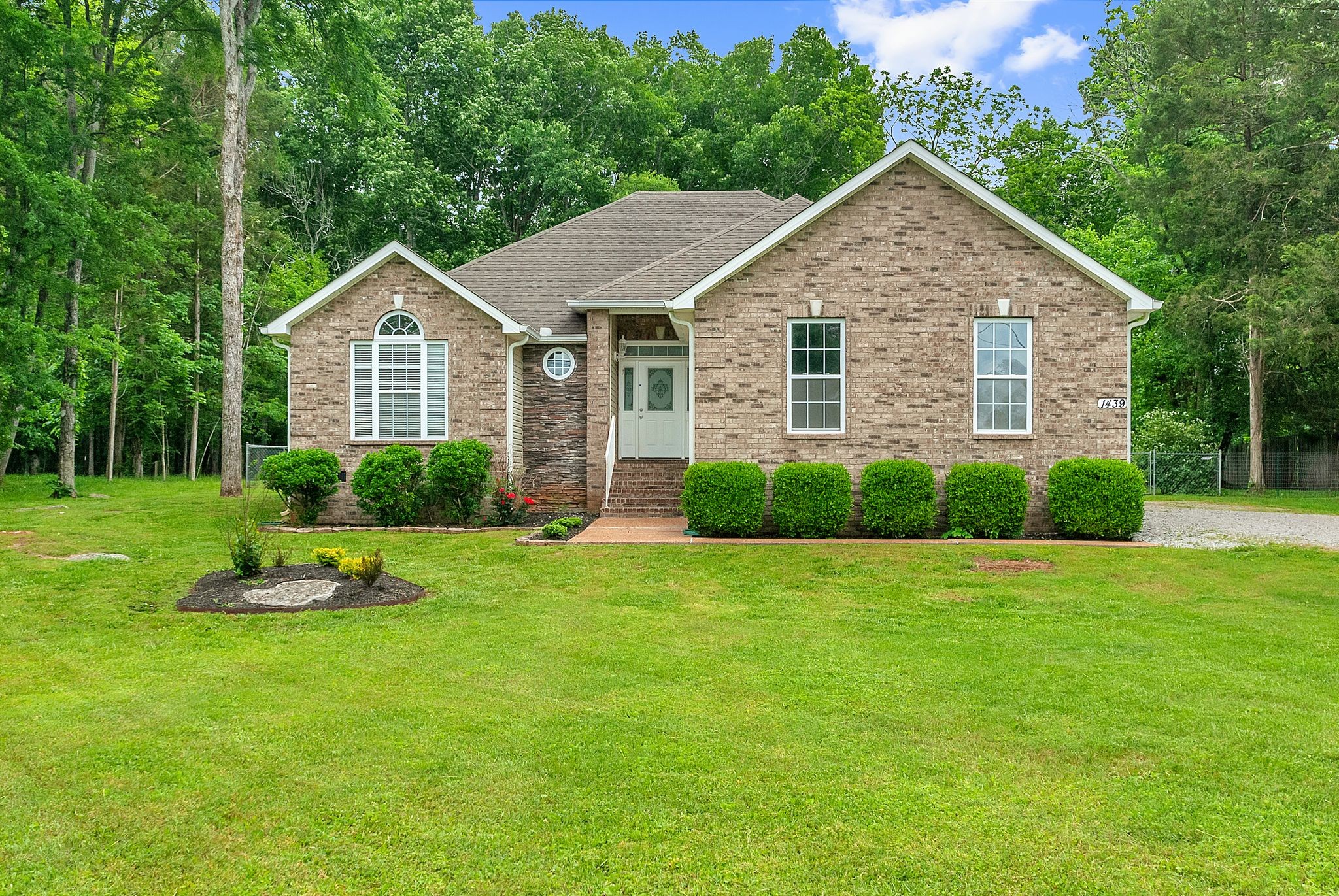 a view of a house with a yard