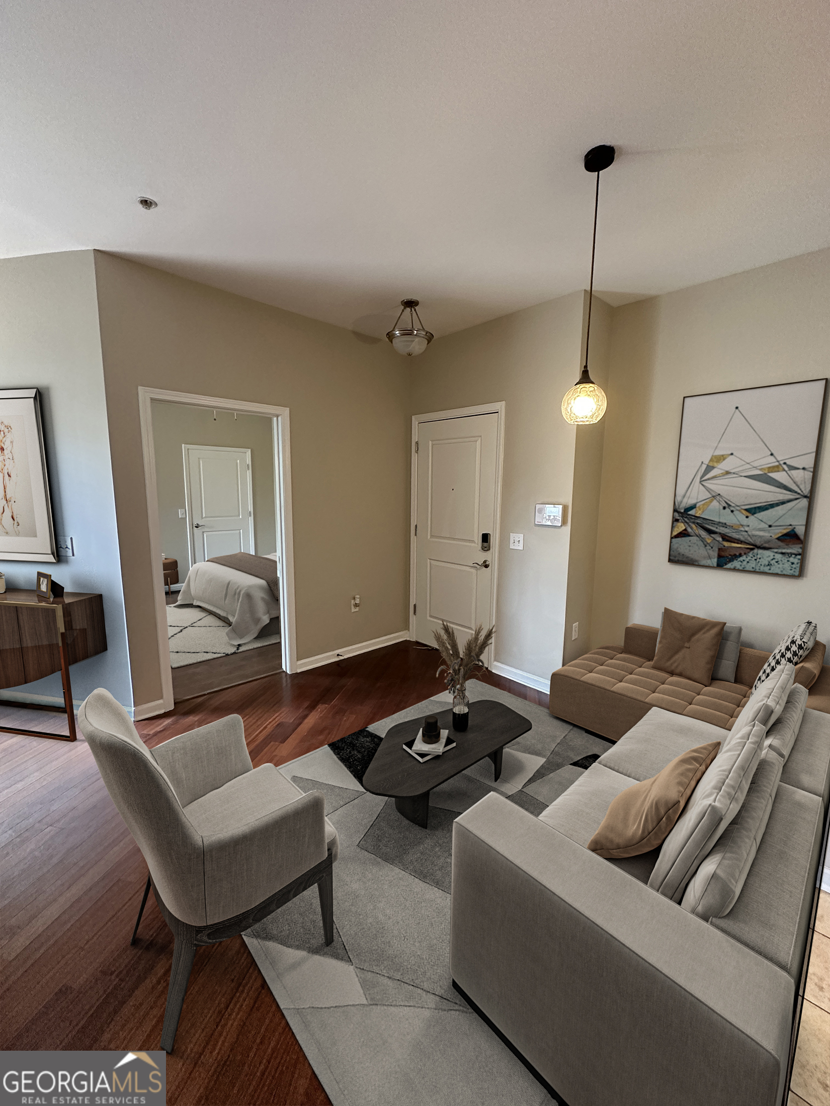 a living room with furniture and a chandelier