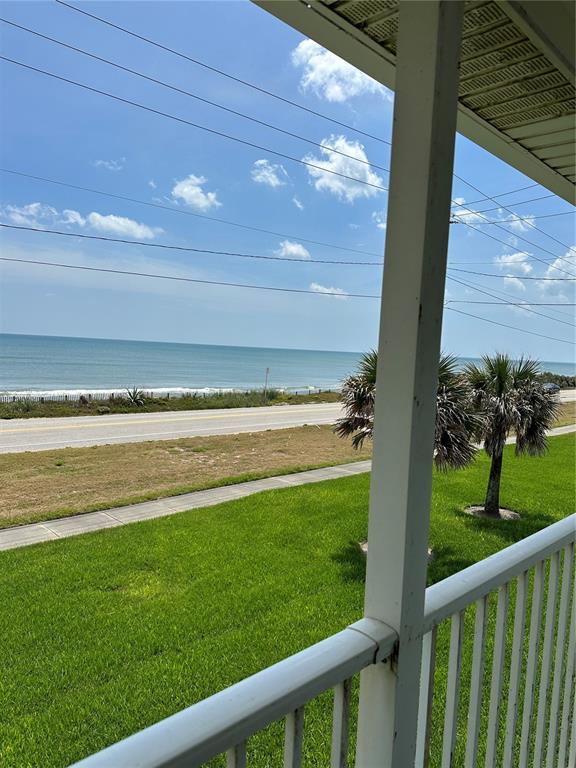 a view of a yard from a balcony