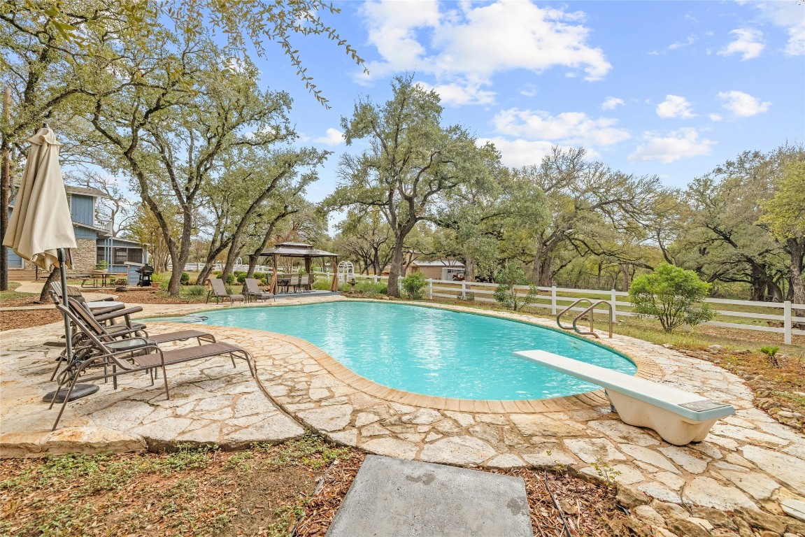 a view of swimming pool with seating space