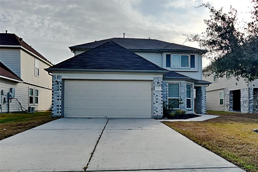 a front view of a house with a garage