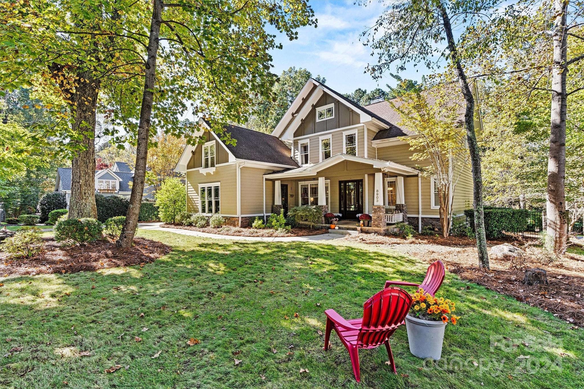 a front view of a house with swimming pool having outdoor seating