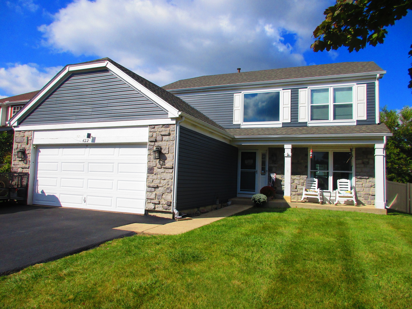 front view of a house with a yard