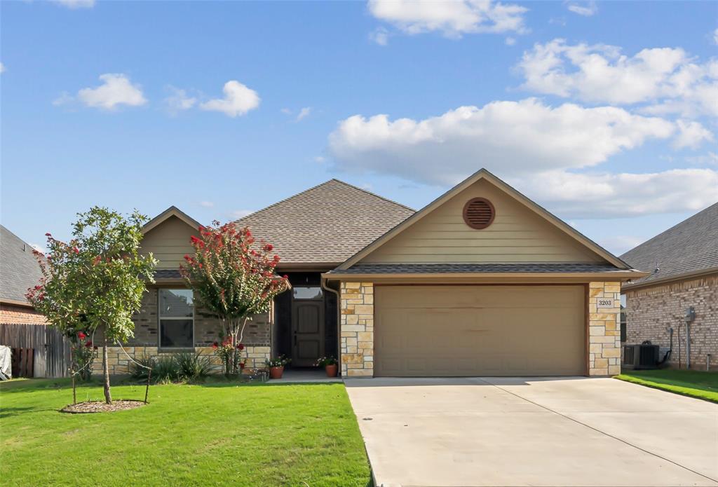 a front view of house with yard and entertaining space