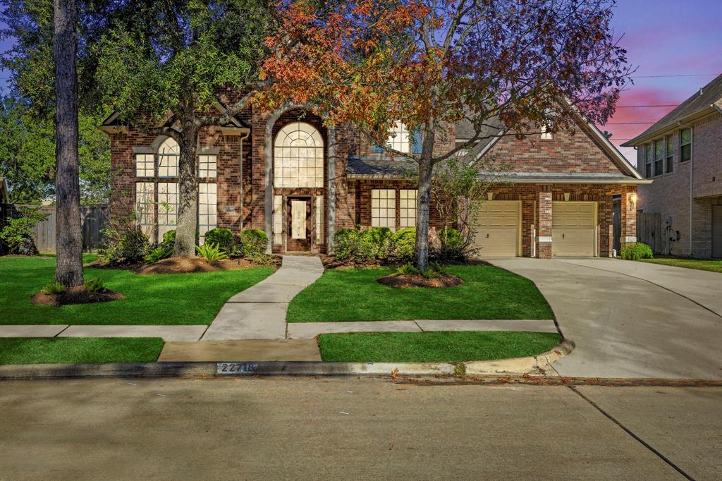 front view of a house with a yard