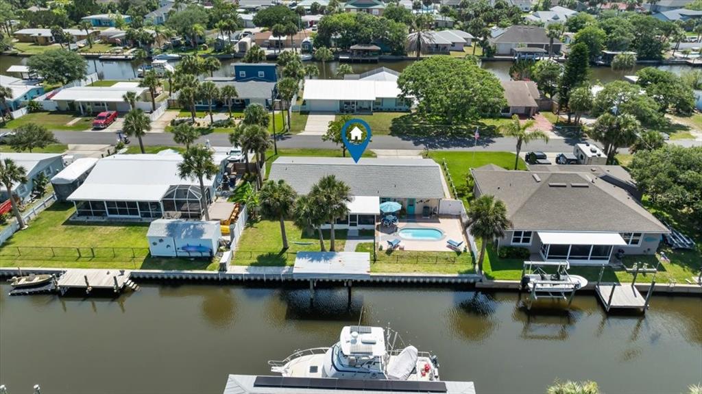 an aerial view of a house with a lake view