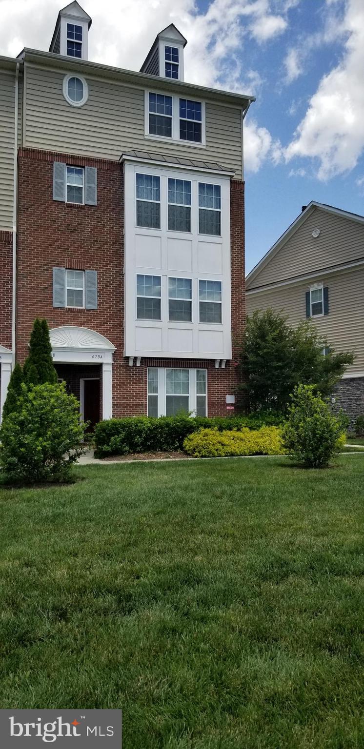 a brick building with a yard