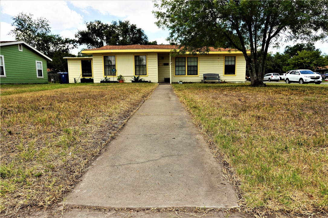 front view of a house with a yard