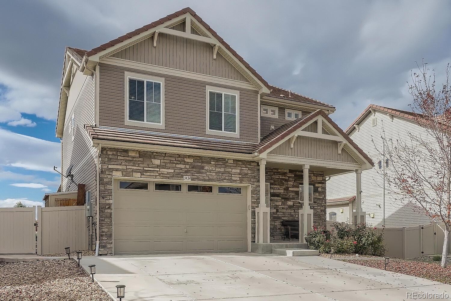 a front view of a house with a garage