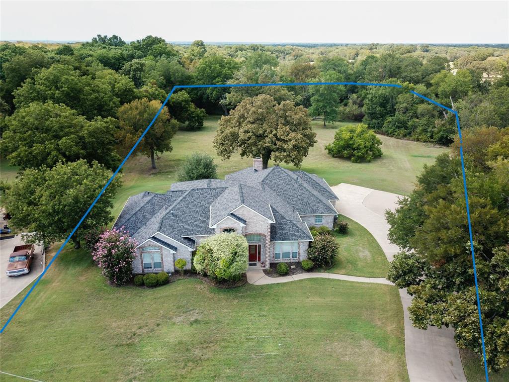 an aerial view of a house with garden