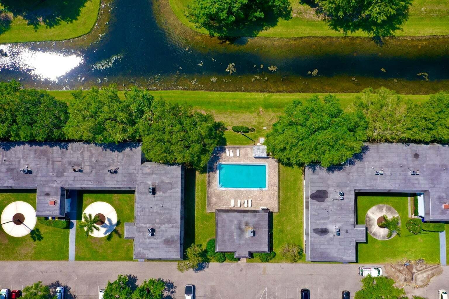 an aerial view of house with yard swimming pool and outdoor seating