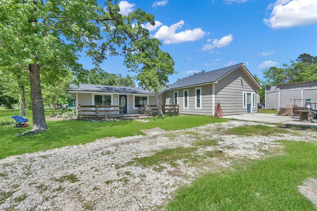 a view of a house with a backyard