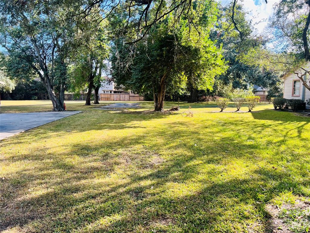 a view of yard with swimming pool