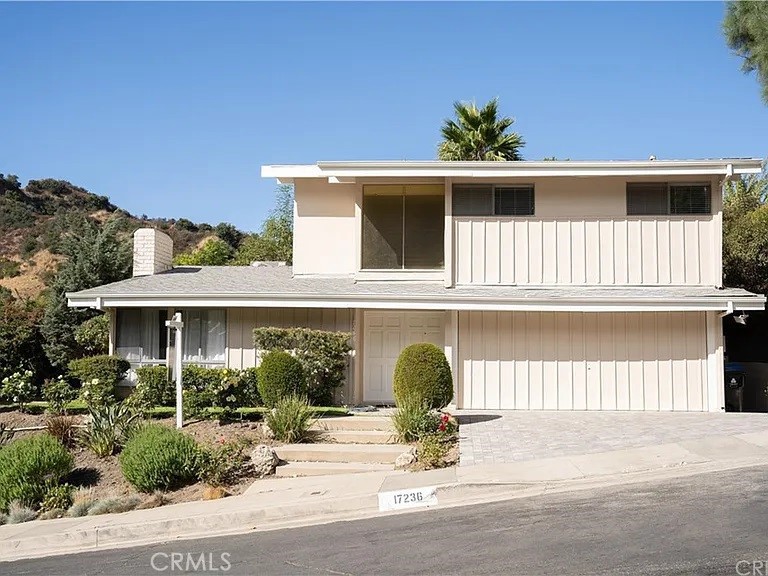 a front view of a house with a outdoor space