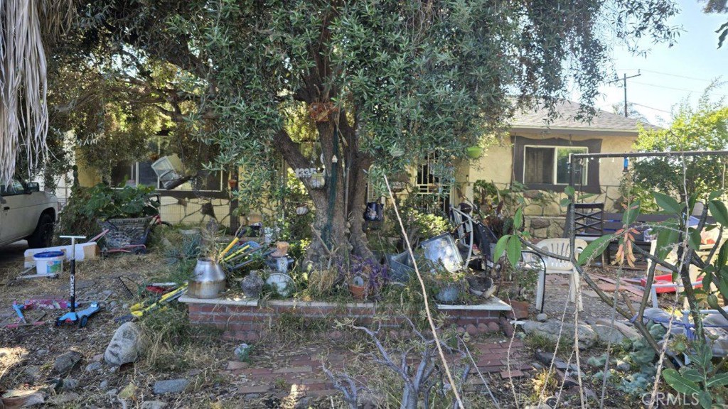 a view of house with outdoor space and sitting area