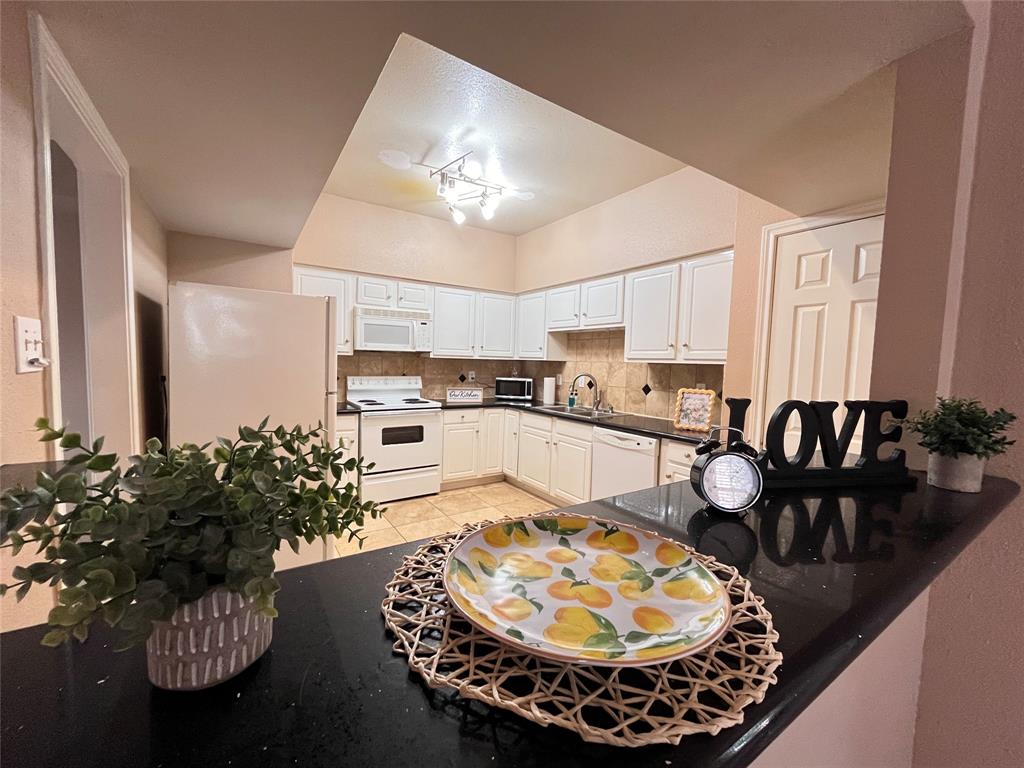 a kitchen with a table and chairs in it