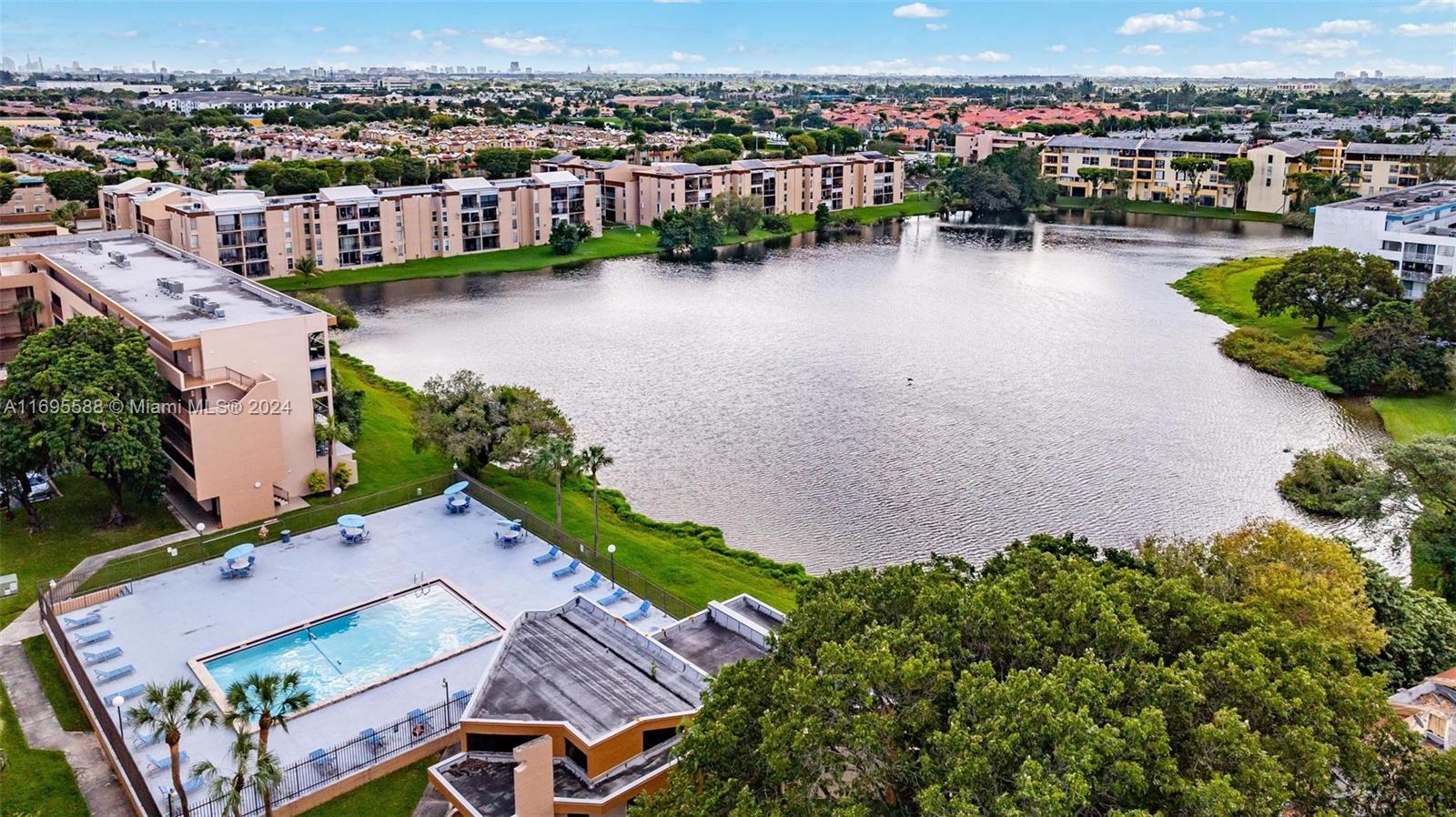 an aerial view of a house with a lake view