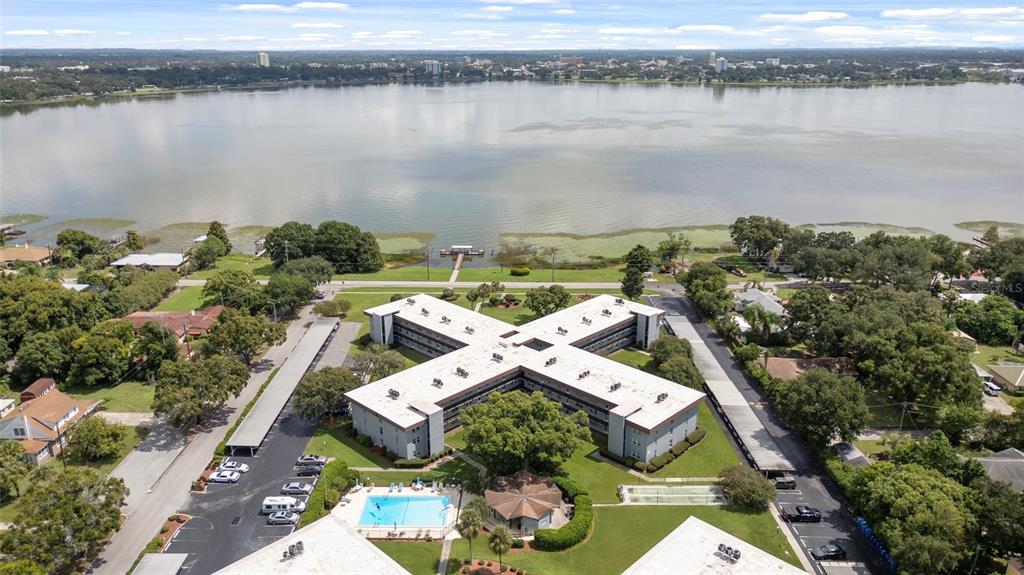 an aerial view of a house with a lake view