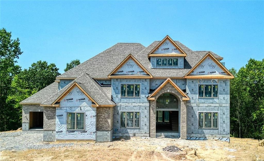 a front view of a house with yard