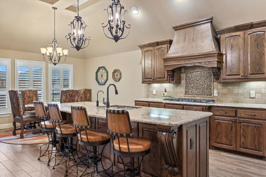 a kitchen with sink and cabinets