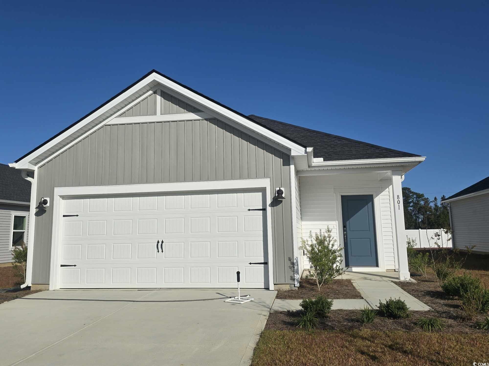 Single story home featuring a garage