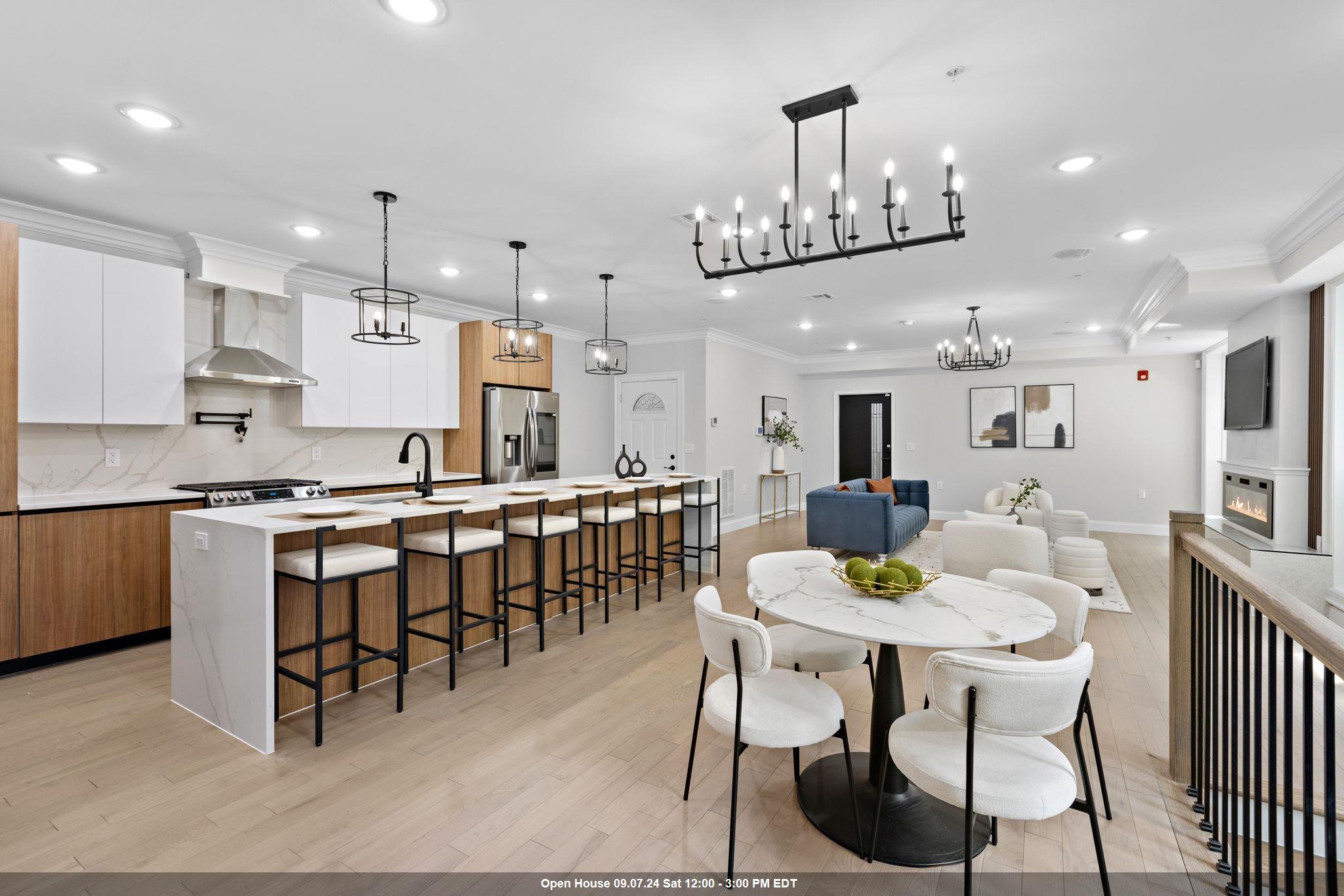 a large kitchen with a table and chairs