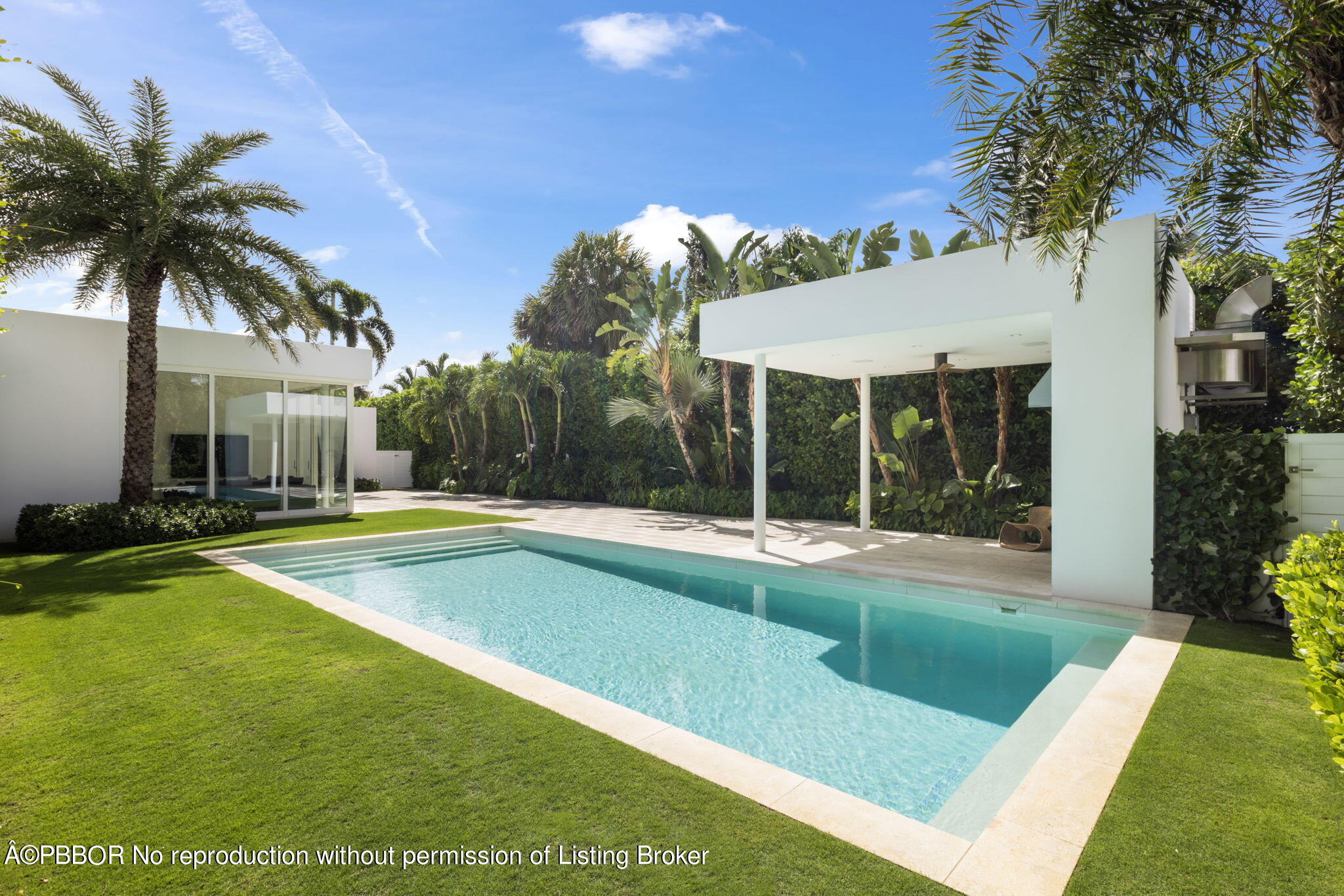 a view of a house with swimming pool and porch with furniture