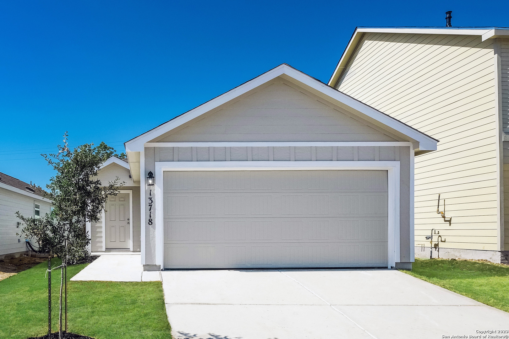 a front view of a house with a yard