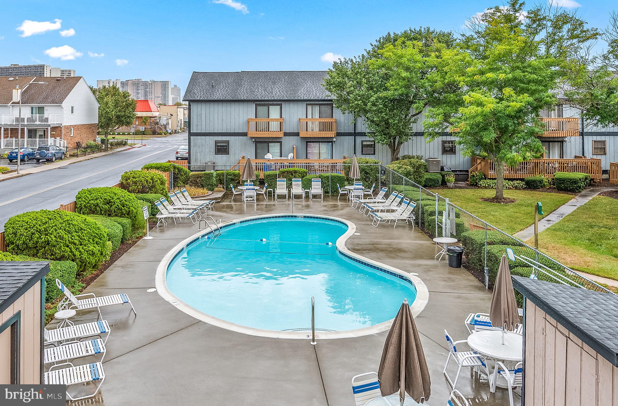 a view of a swimming pool with a patio