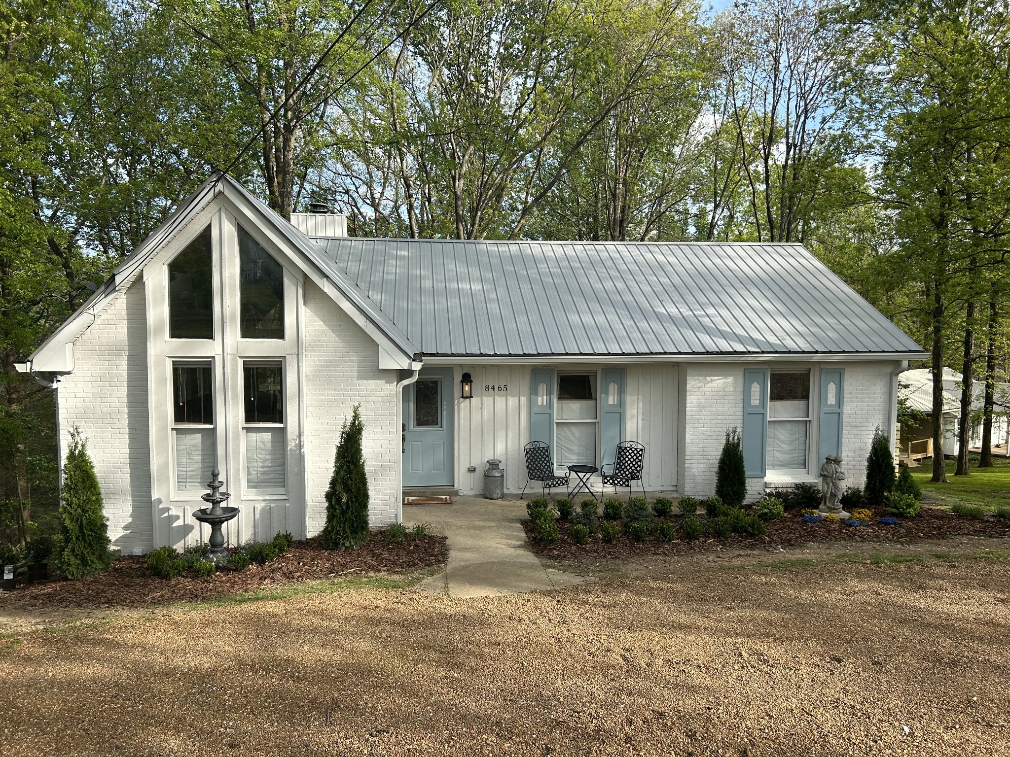 a front view of a house with garden