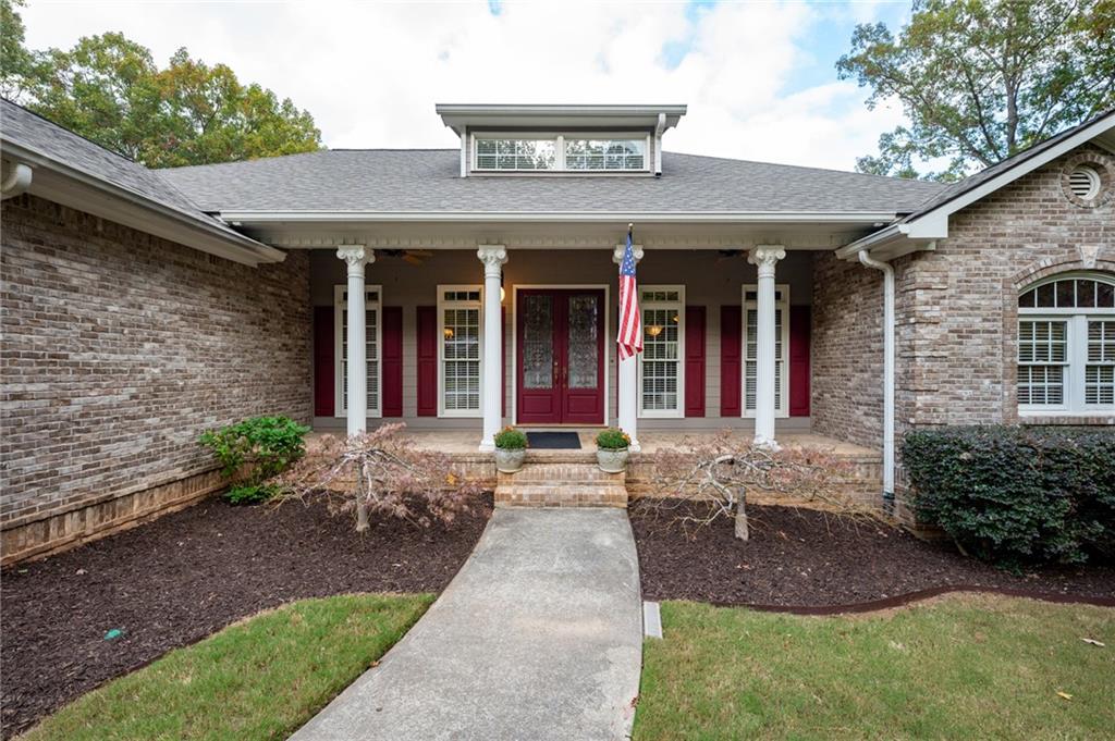 a front view of a house with garden